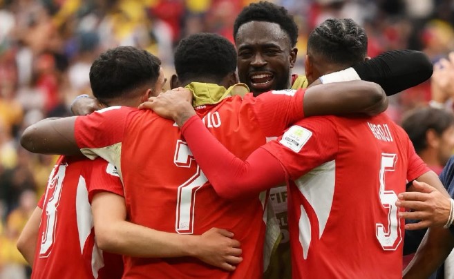 Jogadores comemorando a classificação.