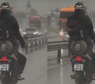 Imagem - Vídeo: mulher é flagrada sentada em botijão de gás na garupa de moto