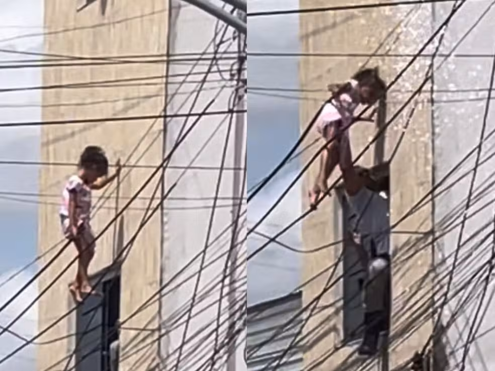 Criança sendo resgatada após cair do 2º andar, fica presa em fiação.